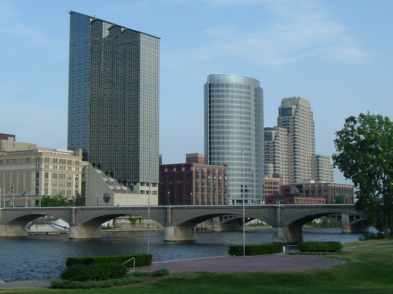 Photograph of skyscrapers along a river.